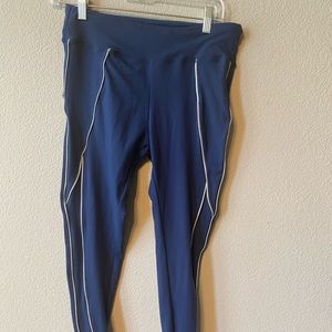 Blue yoga pants with white trim and tie at ankle